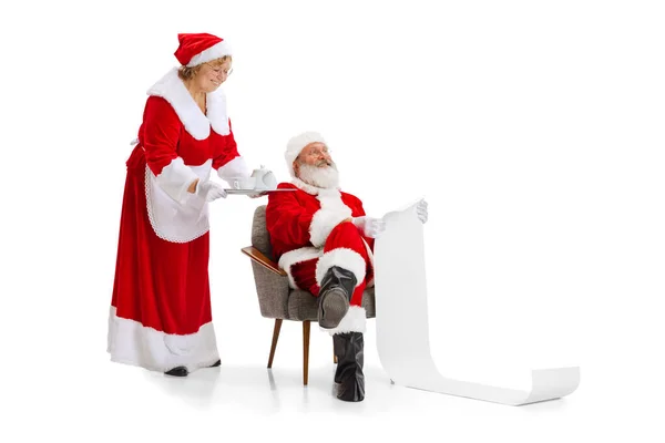 Emotional Santa Claus and his wife, missis Claus congratulating with New Year and Christmas, writing a letter, wish list — Stock Photo, Image