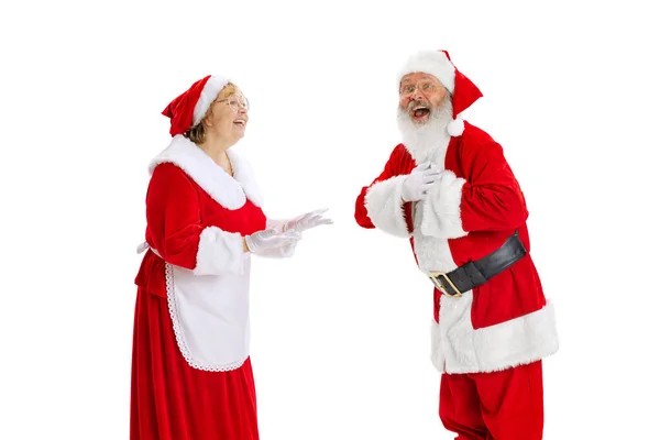 Happy smiling old man in Santa Claus costume and cute elder woman, missis Claus talking isolated on white background. — Stock Photo, Image