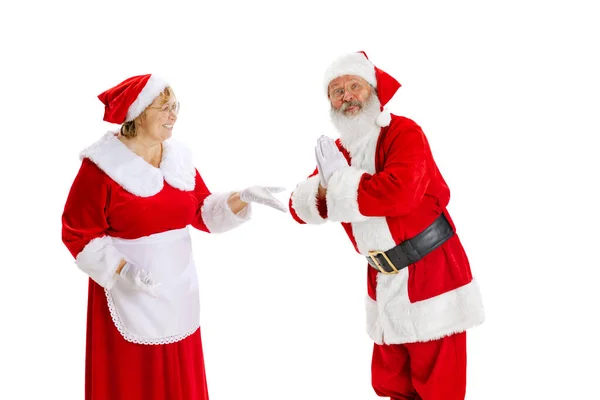 Happy smiling old man in Santa Claus costume and cute elder woman, missis Claus talking isolated on white background. — Stock Photo, Image