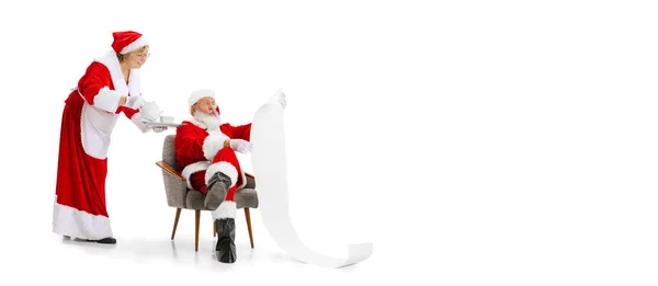 Portrait of middle-age woman and senior man, Santa Claus and his wife isolated on white background. — Stock Photo, Image