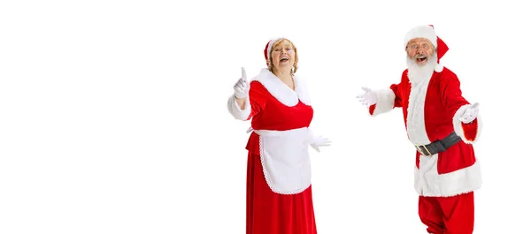 Happy smiling old man in Santa Claus costume and cute elder woman, missis Claus talking isolated on white background. — Stock Photo, Image