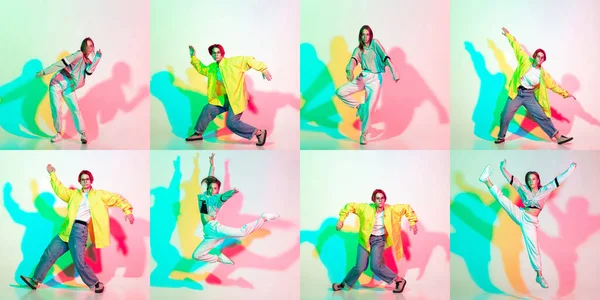 二つのスタイリッシュな女の子,十代の若者たちダンスヒップホップでスタイリッシュな服で色のスタジオの背景にグリッチ効果. — ストック写真