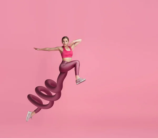 Menina, treinador de fitness, corredor pulando isolado no fundo rosa. Colagem de arte contemporânea. Ilusão. Desporto. — Fotografia de Stock