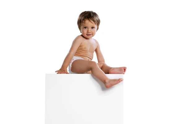 Portrait of little boy, baby, child in diaper isolated over white studio background. Childhood concept — Fotografia de Stock