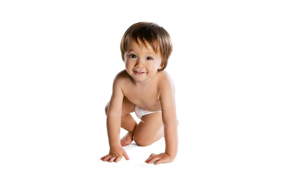 Portrait of little boy, baby, child in diaper isolated over white studio background. Childhood concept — Fotografia de Stock