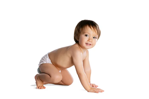 Portrait of little boy, baby, child in diaper isolated over white studio background. Childhood concept — Fotografia de Stock