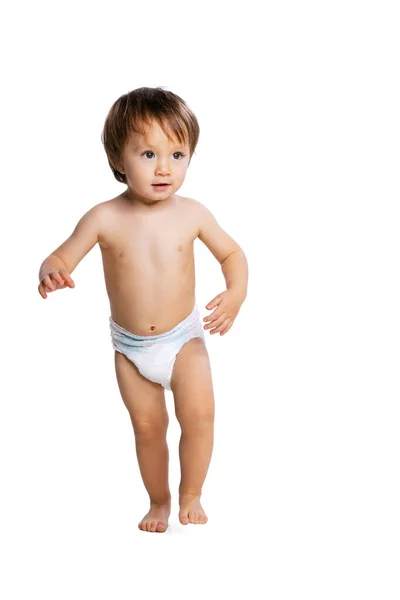 Portrait of little boy, baby, child in diaper isolated over white studio background. Childhood concept — Fotografia de Stock