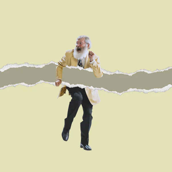 Senior man wearing retro style suit dancing isolated on torn paper background. Contemporary art collage. Minimalism — Stock Photo, Image