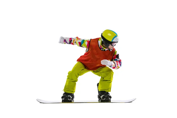 Portrait of young woman in bright sportswear, goggles and helmet snowboarding isolated on white studio background. Concept of winter sports — Stock Photo, Image