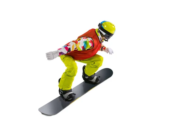 Retrato de mujer joven en ropa deportiva brillante, gafas y casco de snowboard aislado sobre fondo de estudio blanco. Concepto de deportes de invierno —  Fotos de Stock