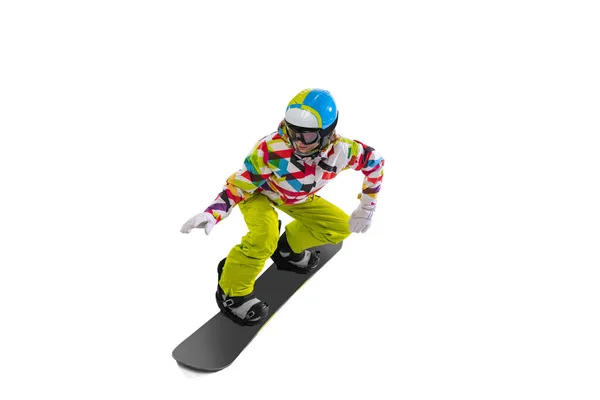 Portrait of young woman in bright sportswear, goggles and helmet snowboarding isolated on white studio background. Concept of winter sports — Stock Photo, Image