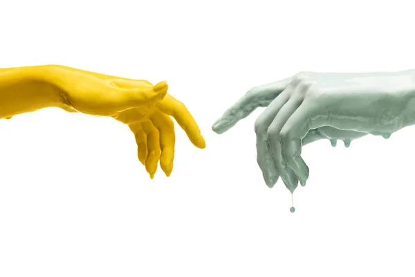 Twee geschilderde handen proberen elkaar te raken geïsoleerd op witte achtergrond in neon licht. Begrip menselijke relatie, gemeenschap, saamhorigheid, symboliek, cultuur en geschiedenis — Stockfoto