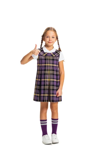 Retrato de criança bonito, menina, aluno em uniforme escolar posando isolado no fundo branco. Conceito de infância, emoções, estudo — Fotografia de Stock