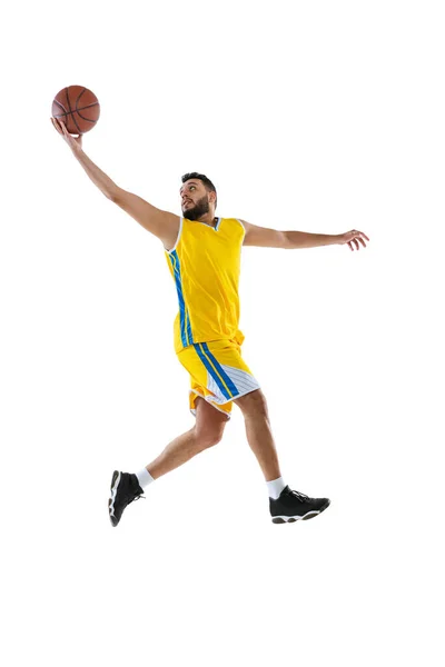 Um jogador profissional de basquete praticando isolado no fundo do estúdio branco. Esporte, movimento, atividade, conceitos de movimento. — Fotografia de Stock