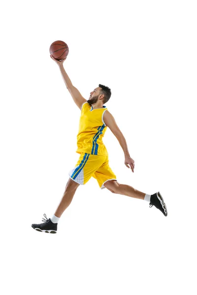 Dynamic portrait of professional basketball player jumping with ball isolated on white studio background. Sport, motion, activity, movement concepts. — Stock Photo, Image