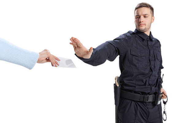 Portrait of young man, policeman wearing black uniform refuses a bribe isolated on white background. Concept of job, caree, law and order.