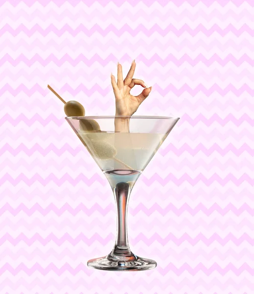 Contemporary art collage, modern design. Party mood. Female hand stick out of cocktail glass and gesturing isolated on light background — Stock Photo, Image