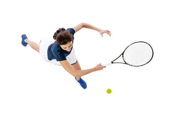 Flygfoto av ung vacker flicka, tennisspelare i sportkläder spelar tennis isolerad på vit bakgrund. Skönhet, sport koncept. — Stockfoto