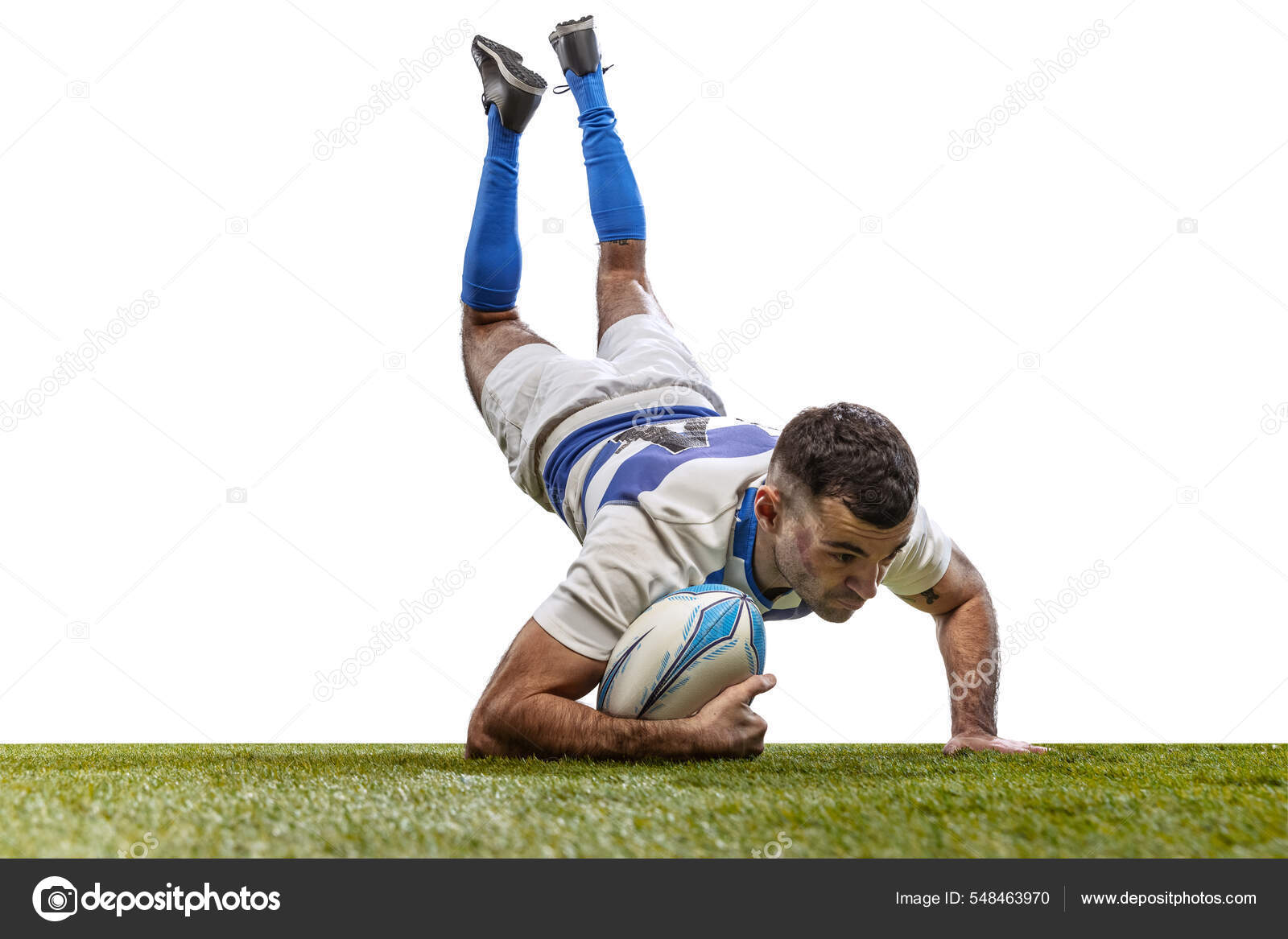 In action. Male rugby player catching ball in jump isolated on white