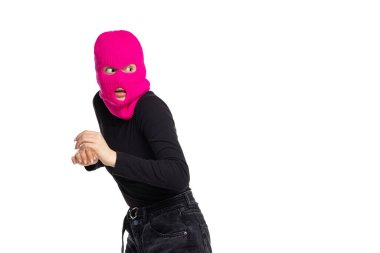 Portrait of young anonymous person wearing black outfit and balaclava isolated on white background. Concept of art, fashion, anti-terrorizm clipart