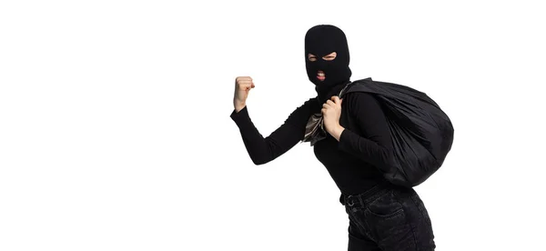 Portrait of young anonymous person wearing black outfit and balaclava isolated on white background. Concept of art, fashion, anti-terrorizm — Stock Photo, Image