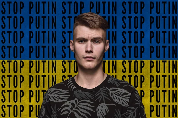 Portrait of young man asking to stop Putin isolated over blue and yellow flag background with lettering