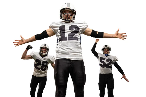 Winner emotions. Three young sportive men, professional american football players in sports uniform and equipment in action isolated on white background. Concept of super bowl