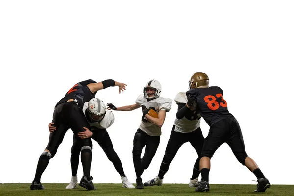 Fight for ball. Group of young sportive men, professional american football players in sports uniform and equipment in motion isolated on white background. Concept of super bowl — Stock Photo, Image