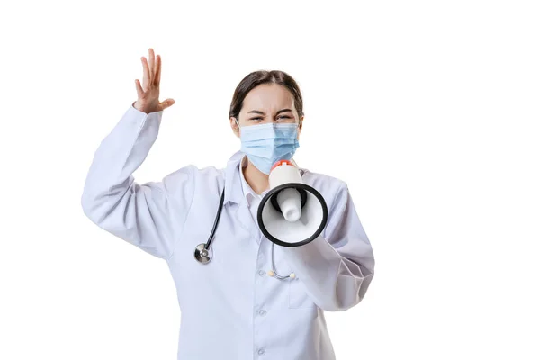 Portrait of young woman, doctor, therapeutic or medical advisor wearing face mask and white uniform isolated on white background. Health care concept — Stock Photo, Image