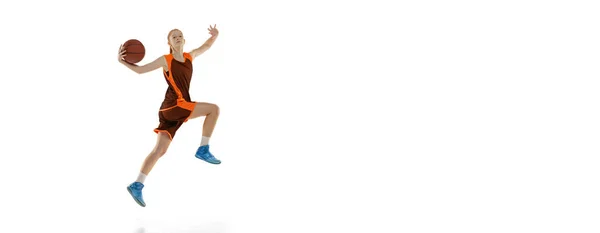 Portrait of professional teen basketball player in motion, training, throwing ball in jump isolated over white studio background. Flyer — Stock Photo, Image