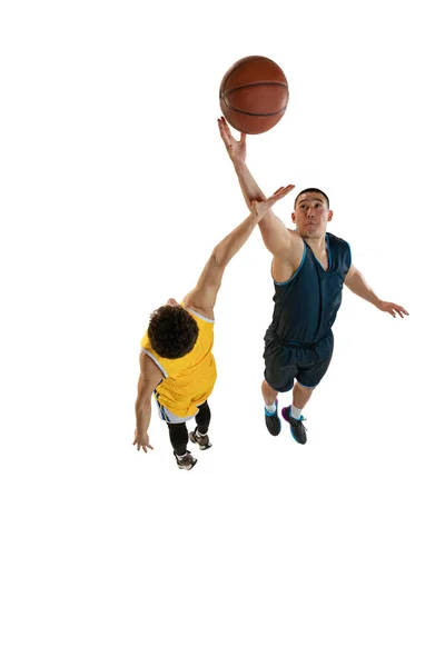 Top view of two young basketball players training with ball isolated on white studio background. Motion, activity, sport concepts. — Stock Photo, Image