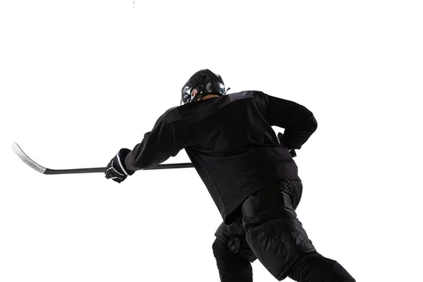 Back view portrait of professional hockey player in motion, training isolated over white studio background — ストック写真