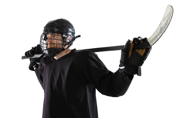 Portrait of man, professional sportsman, hockey player in black protective uniform posing isolated over white background. Trainer — Stock Photo, Image