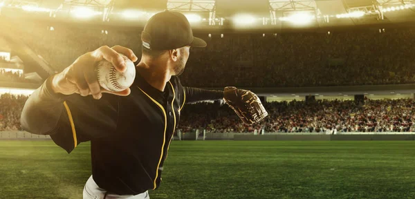 Professional baseball player taking a shot during match in crowed sport stadium at evening time. Sport, win, winner, competition concepts. — Stock Photo, Image
