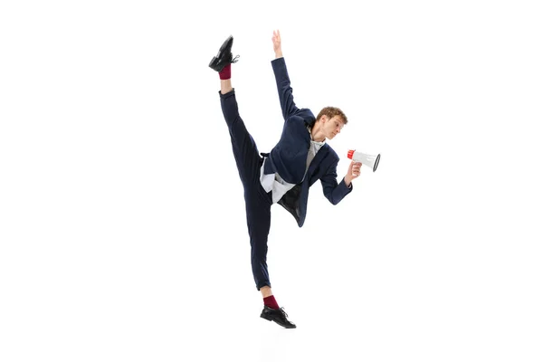 Portrait of flexible man in business style clothes dancing isolated on white studio background. Business, start-up, open-space, inspiration concept. — Stock Photo, Image