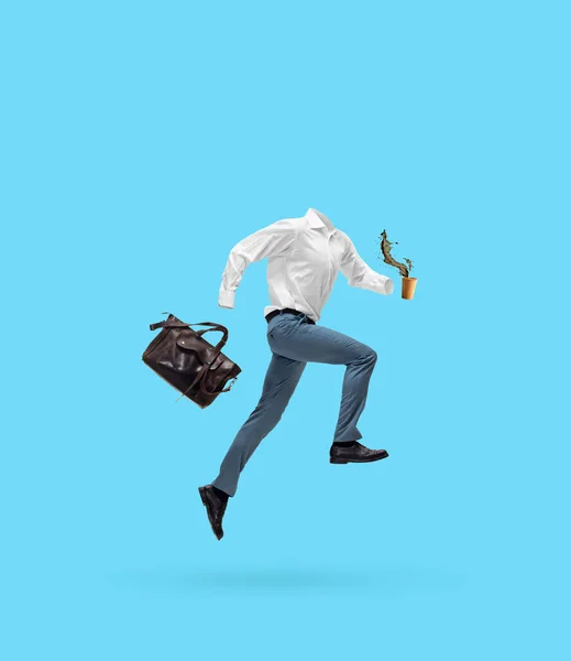 Portrait of invisible man wearing modern business style outfit running, jumping isolated on blue background. Concept of fashion, creativity, work, caree — ストック写真