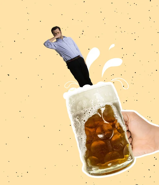 Contemporary art collage. Funny man jumping into cool foamy lager beer isolated over yellow background — ストック写真