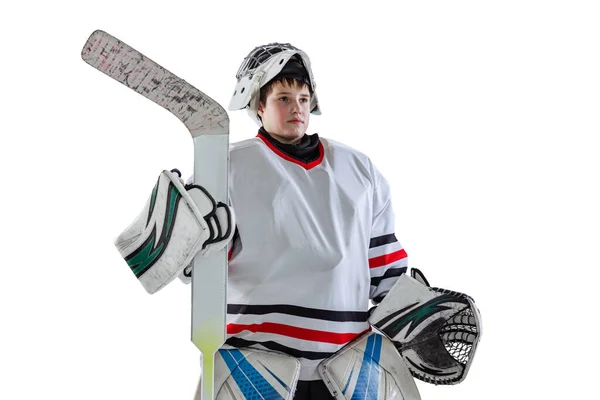 Half-length portrait of boy, child, hockey player in uniform of goalkeeper posing isolated over white studio backgrund — Stock fotografie