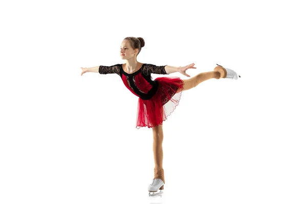Portrait of little flexible girl, figure skater wearing stage attire posing isolated on white studio backgound. Concept of movement, sport, beauty. — Stock Photo, Image