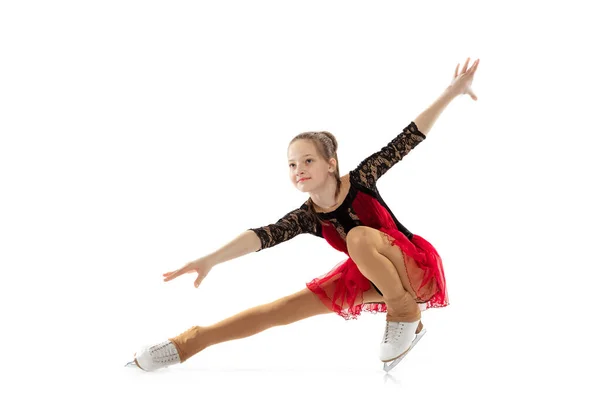 Portrait of little flexible girl, figure skating wearing stage attire posing isolated on white studio backgound. Concept of movement, sport, beauty. — Stockfoto