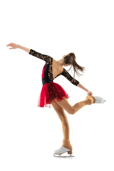 Portrait of little flexible girl, figure skater wearing stage attire posing isolated on white studio background. Concept of movement, sport, beauty. — Stockfoto