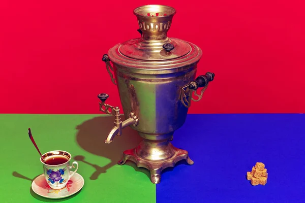 Colorful bright image of old-fashioned kettle called samovar isolated over red background — Stock Photo, Image
