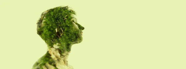 Creative image. Profile silhouette of young transparent man and nature, grass landscape isolated over light green background. Flyer — Stock fotografie
