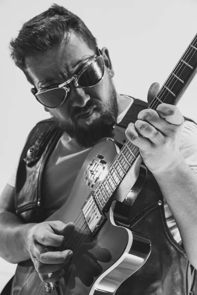 Black and white portrait of stylish man, rock musician with electric guitar isolated on white background. Rehearsal base Concept of art, music, style — 스톡 사진