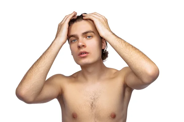 One young handsome man shirtless isolated on white studio background. Concept of mens health, antiage, self-care, body and skin care. — Stockfoto