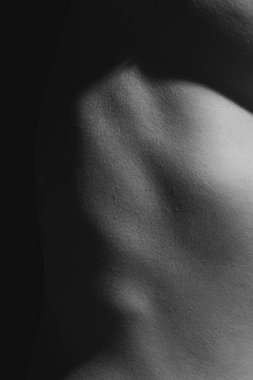 Detailed texture of human female skin. Close up part of womans body. Skincare, bodycare, healthcare, hygiene and medicine concept. Macro photography