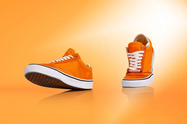 Walk Modern Unisex Footwear Sneakers Isolated Orange Background Fashionable Stylish — Foto de Stock