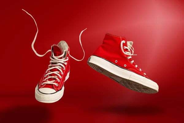 Levitation Flying Sports Shoes Red Background Sneakers Trainers Isolated Athletic — ストック写真