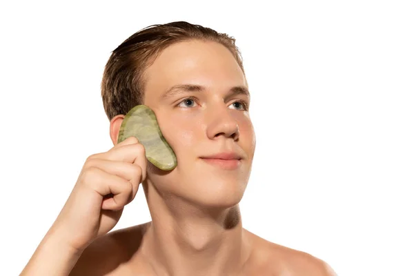 Young Attractive Man Perfect Smooth Skin Applying Face Massagers Isolated — Stock Fotó