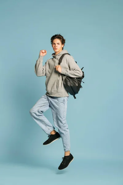 Ready Studying Happy Student Jeans Grey Hoodie Jumping Isolated Blue — Stockfoto